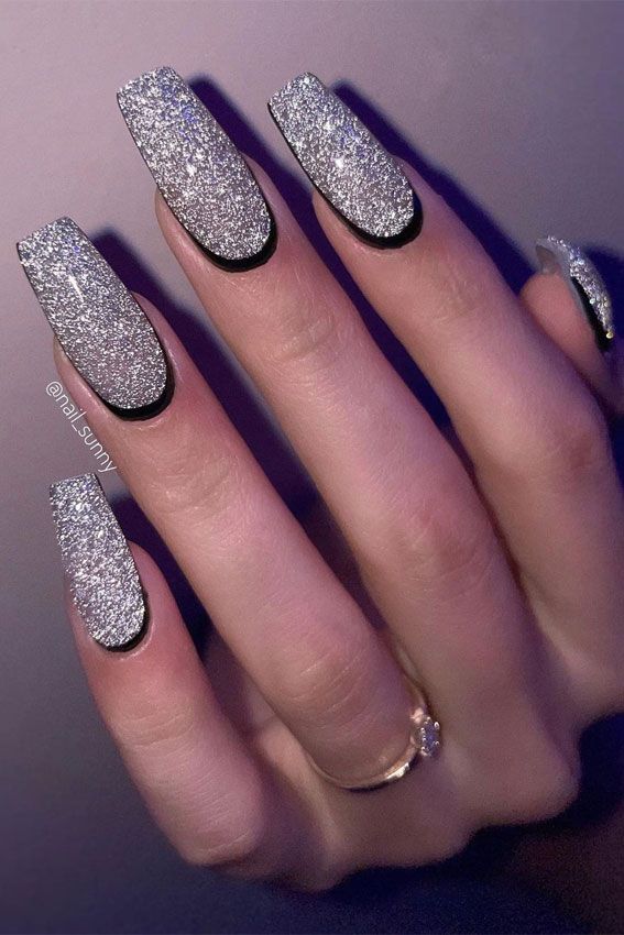 Stunning Square-Shaped Nails Adorned with Silver Glitter and Black Outline for Glamorous Style.