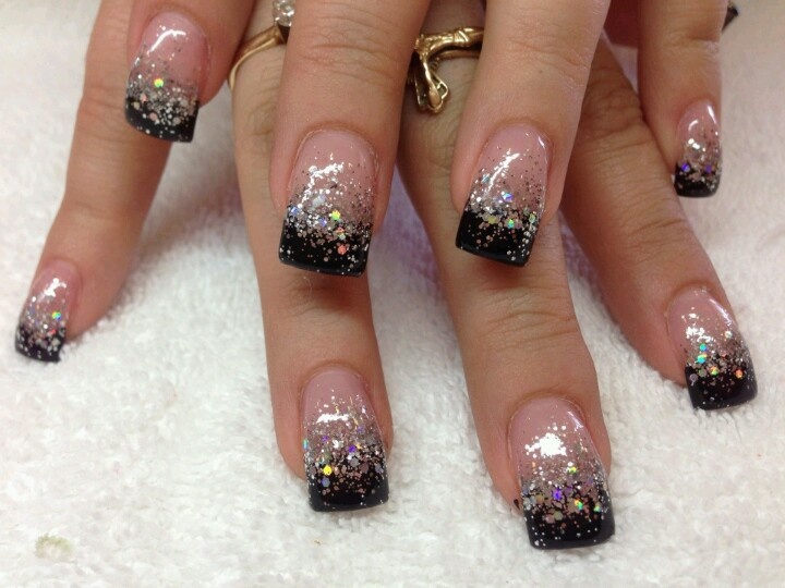 Chic Ombre Nail Design: Soft Pink and Black with Glitter Accents for Glamorous Occasions.