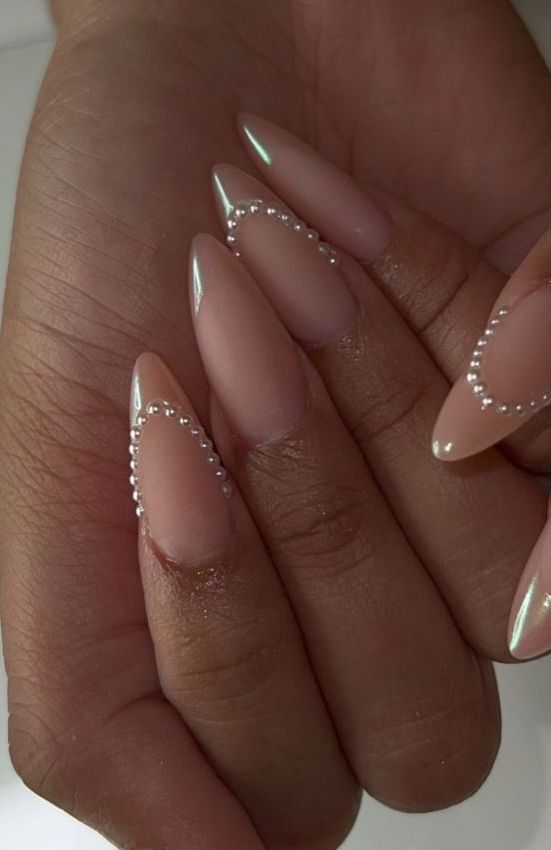 Sophisticated Almond-Shaped Nail Design with Iridescent Pearl Accents