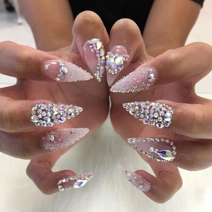 Dazzling Rhinestone-Embellished Long Pointed Nail Design with Elegant Gradient Effect.