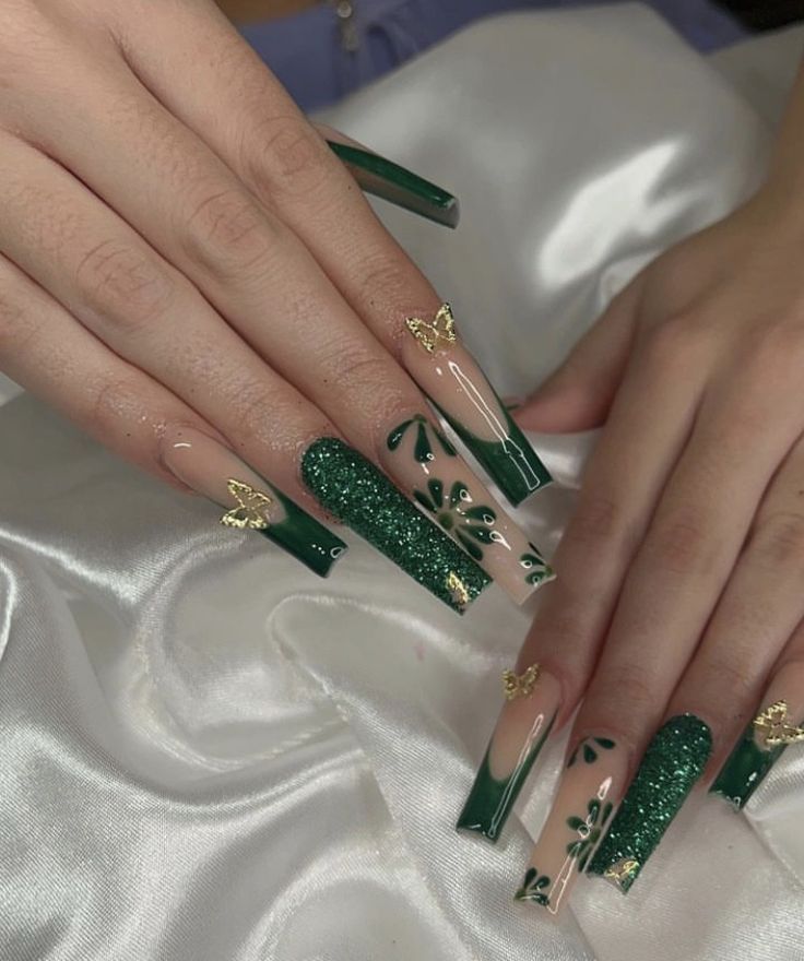 Elegant Nail Design with Deep Green, Glitter Accents, and Intricate Floral Motifs