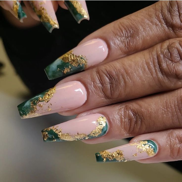 Sophisticated Nail Design: Deep Green and Nude Marbling with Gold Leaf Accents.