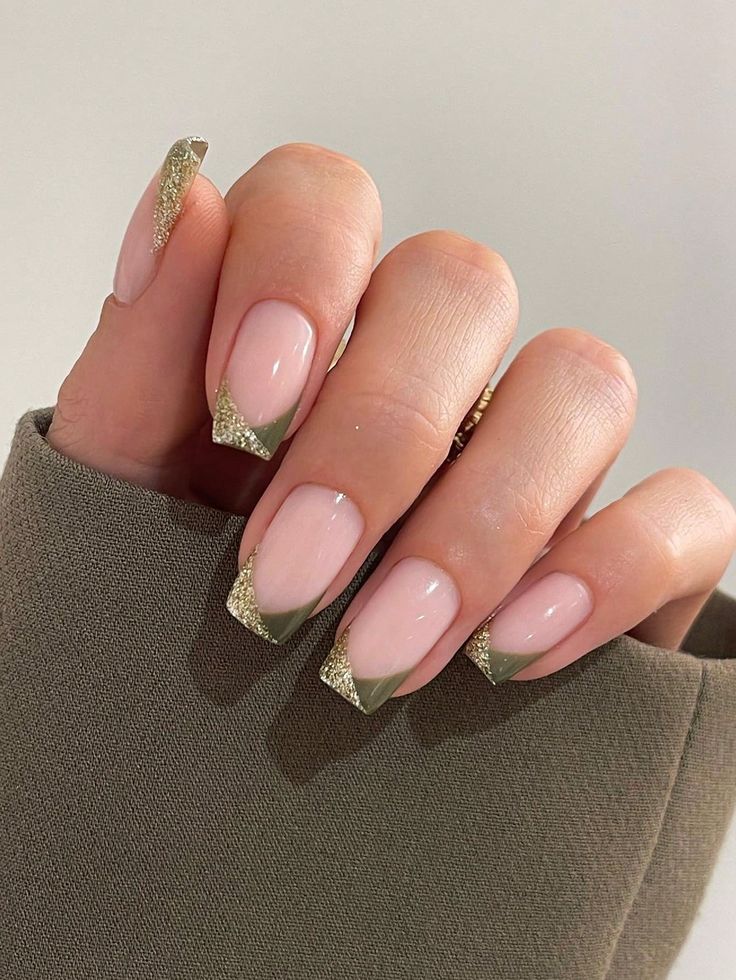 Sophisticated Soft Pink Nail Design with Green Tips and Glamorous Gold Accents.