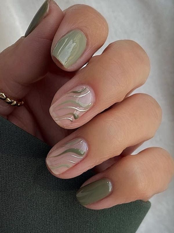 Elegant Chic Nail Design: Muted Greens and Soft Pinks with Glossy Marble Effect.