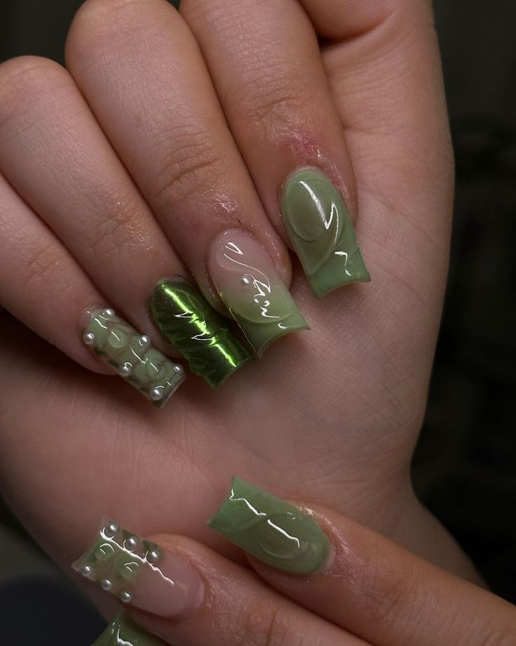 Stylish Modern Nail Design with Glossy and Textured Green Shades, Embellished with Pearls.