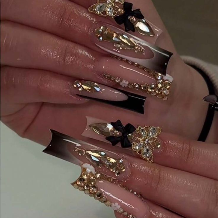 Elegant Black and Nude Coffin Nail Design Adorned with Rhinestones and Golden Details