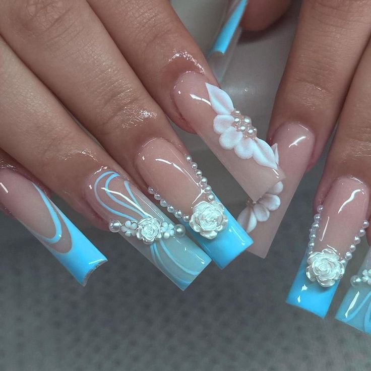 Sophisticated Soft Blue and Nude Floral Nail Design with 3D Embellishments.