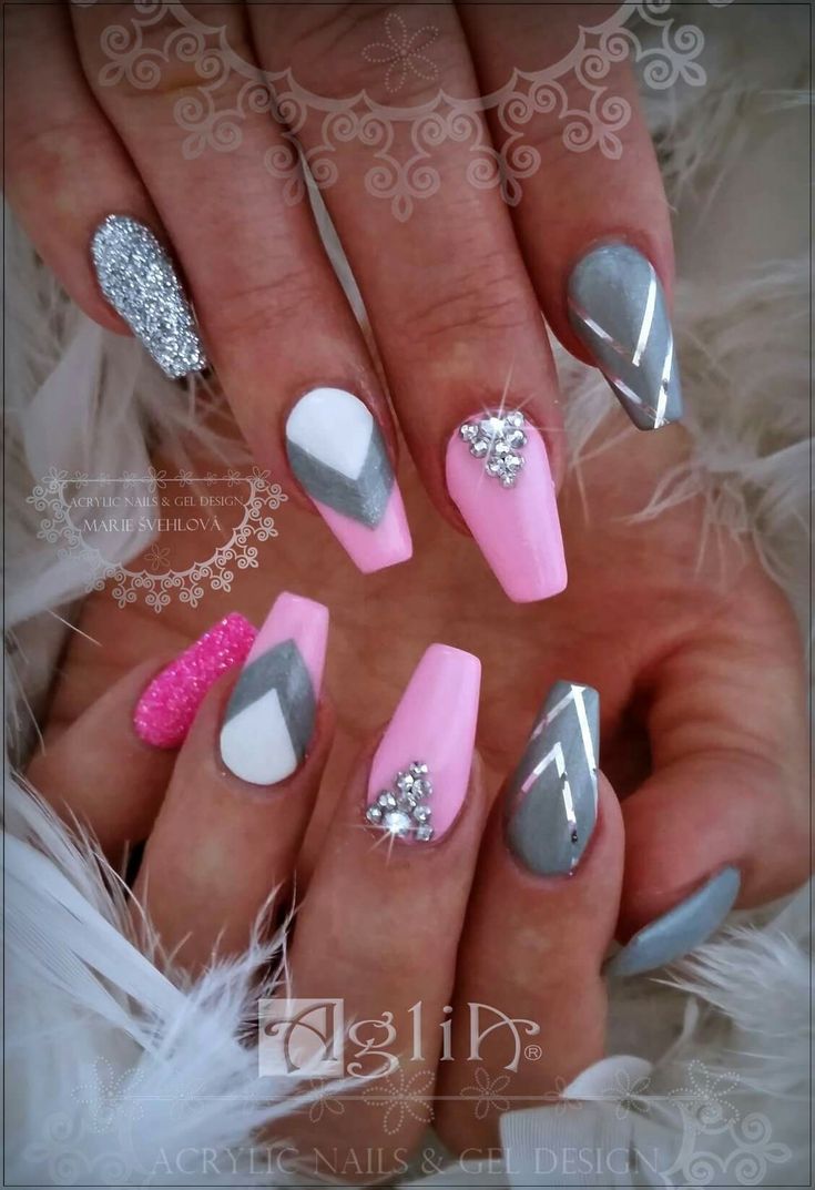 Vibrant Pink, Gray, and White Nail Design with Glitter and Geometric Patterns for Glamorous Occasions.