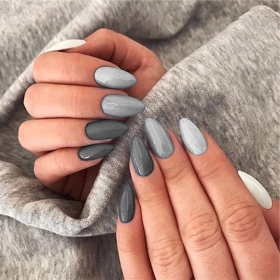 Sophisticated Gray Ombre Almond Nail Design with Playful Accents