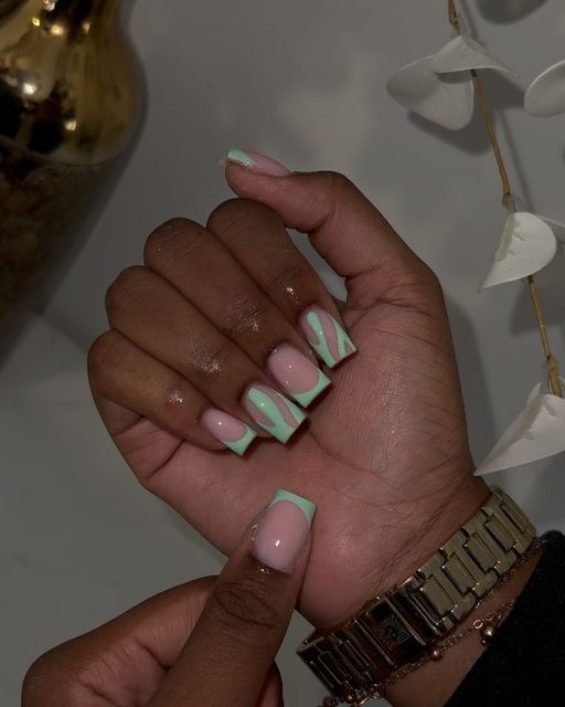 Elegant Geometric Nail Design in Soft Pink and Mint Green.