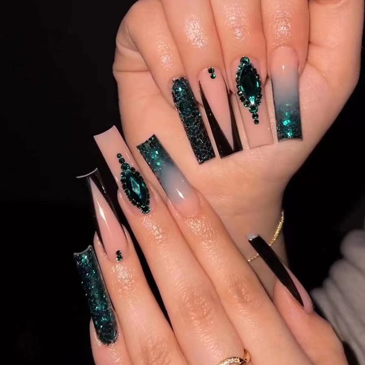 Elegant Ombre Nail Design with Emerald Glitter and Gemstone Embellishments