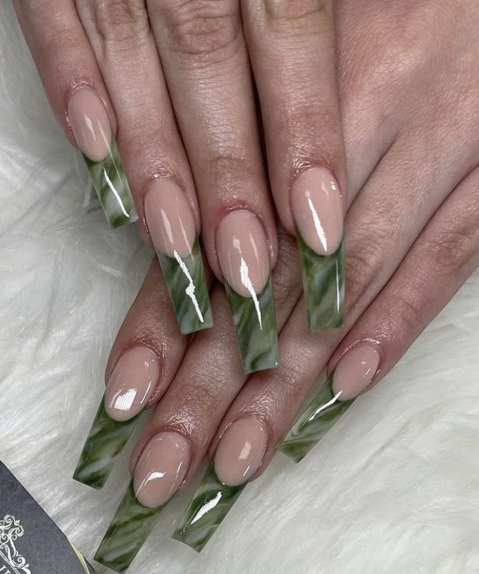 Chic Contemporary Nail Design: Soft Nude with Striking Green Marble Patterns on Long Square Tips.