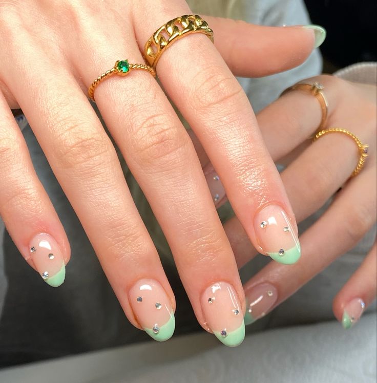 Chic Mint-Green French Tip Nails with Rhinestones and Timeless Nude Base