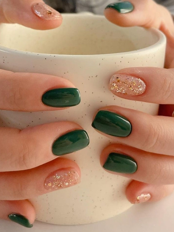 Chic Dark Green and Sparkly Nude Nail Design for Fall/Winter Elegance.