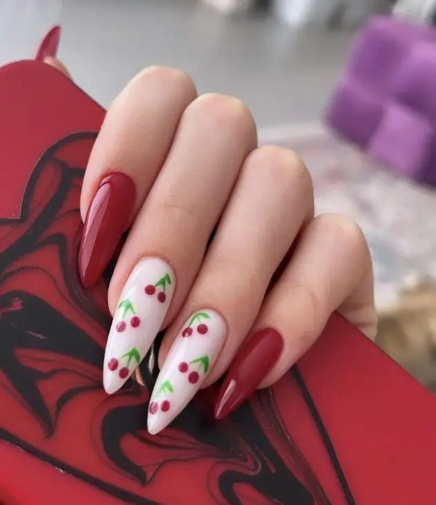 Elegant Cherry Blossom Nail Design: Deep Red and Soft White Tones for Any Occasion.