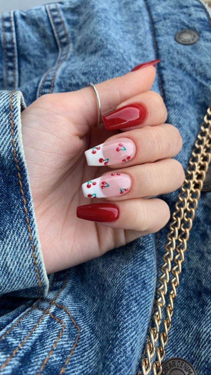 Whimsical Cherry Blossom Nail Design: Glossy Red Meets Soft Pastels.