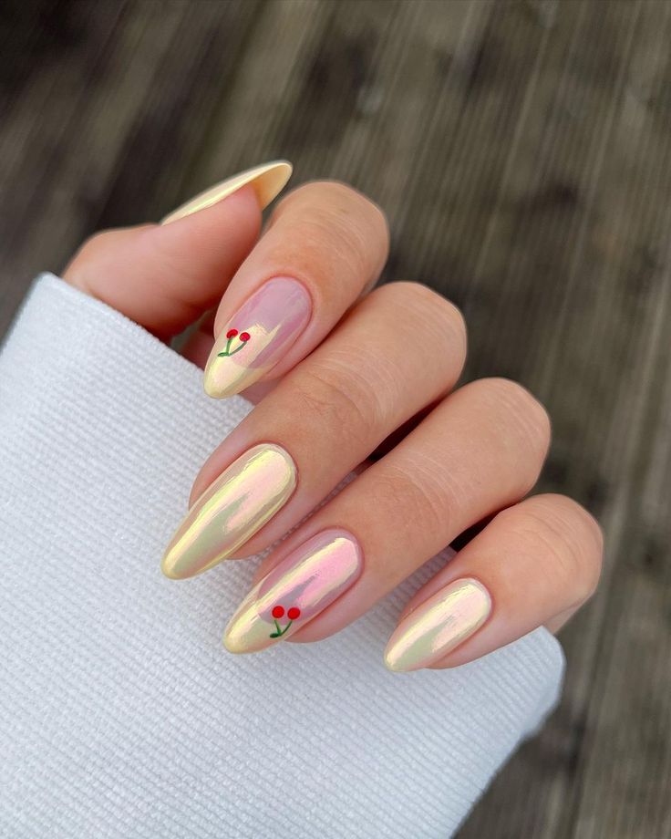 Chic Nail Art: Soft Pink and Shimmering Gold with Cherry Blossom Accents.