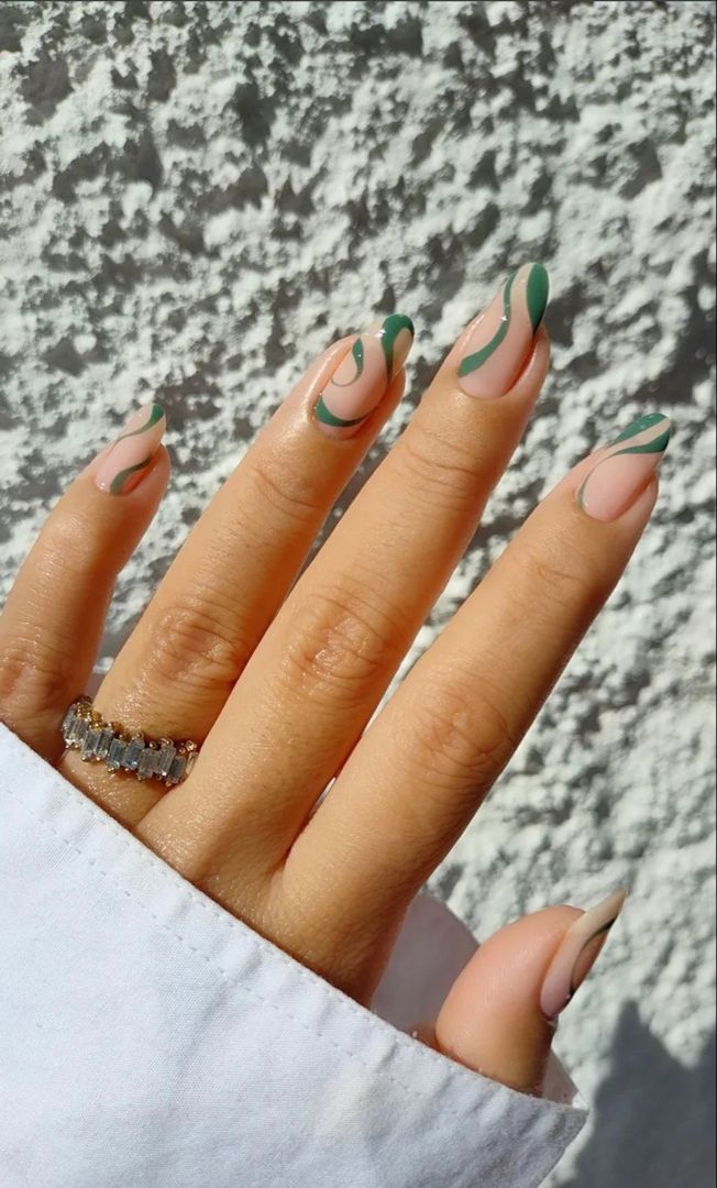 Chic Almond-Shaped Nail Design with Soft Nude and Vibrant Green Accents