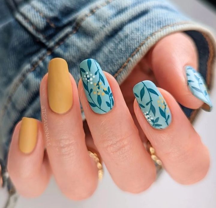 Vibrant Spring-Inspired Floral Nail Art with Elegant Matte and Shiny Finishes.