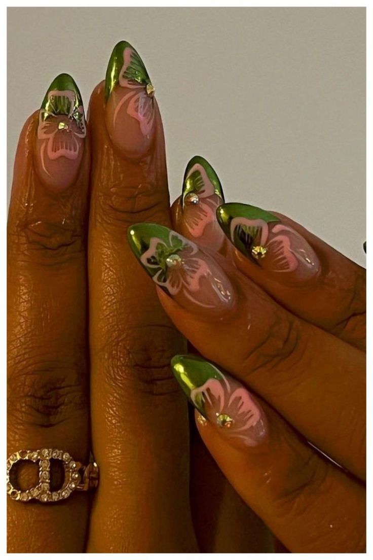 Elegant Floral Nail Design with Vibrant Green French Tips and Sparkling Embellishments