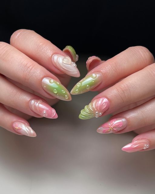 Elegant Floral-Inspired Nail Design with Pastel Colors and 3D Elements.