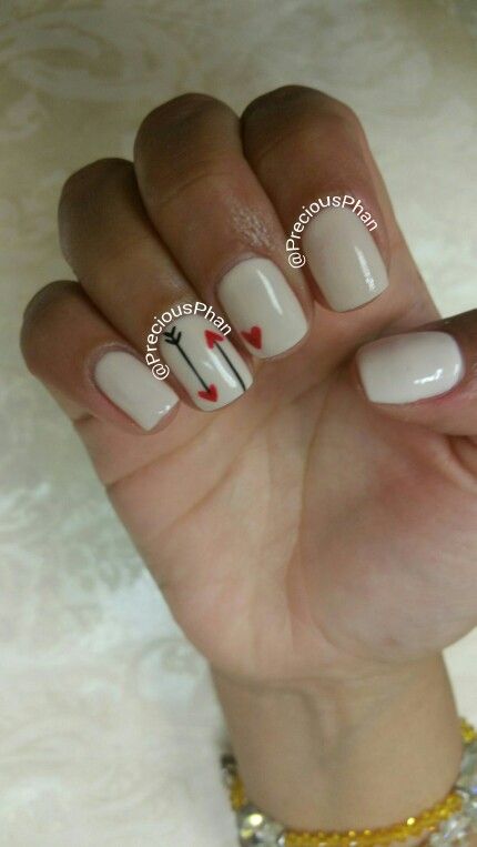 Charming Neutral Beige Nail Design with Playful Red Hearts and Elegant Line Drawing.