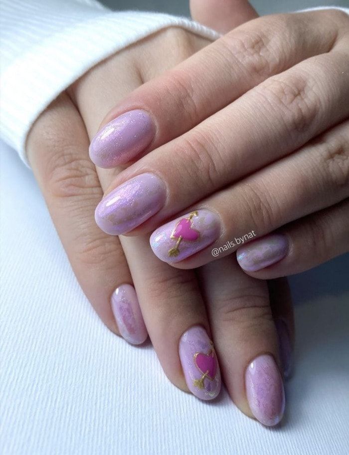 Elegant Soft Lavender Nail Design with Gold Accents and Heart Motifs