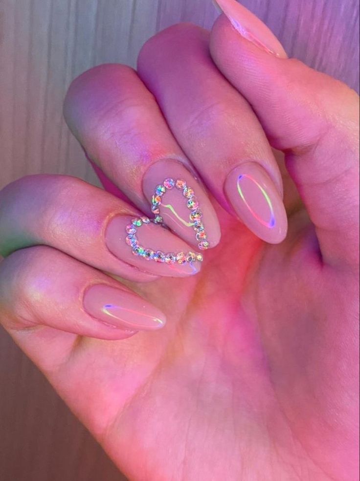 Chic Nude Nail Design with Sparkling Rhinestone Heart: Elegant Glamour for Any Occasion