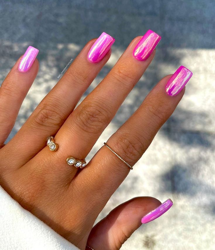 Stunning Glossy Pink Nails with Unique Design and Striking Vertical Streaks.