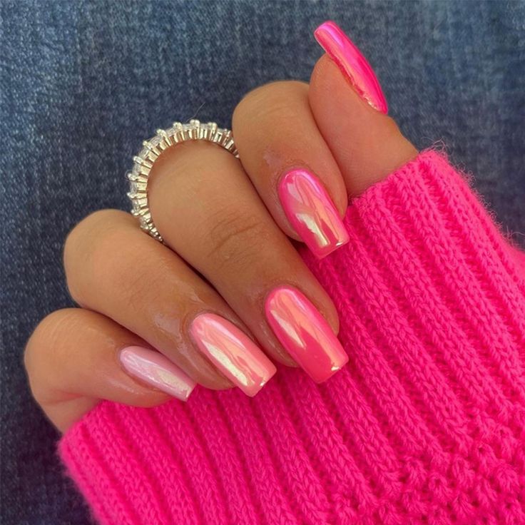 Elegant Vibrant Ombre Pink Nail Design Paired with a Playful Knit Sweater.