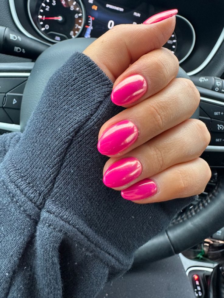 Bold and Elegant Vibrant Pink Glossy Nails for Any Occasion.