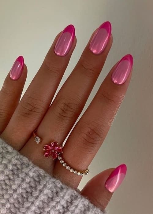 Elegant Almond-Shaped Pink Manicure with Glossy Finish and Floral Accents.