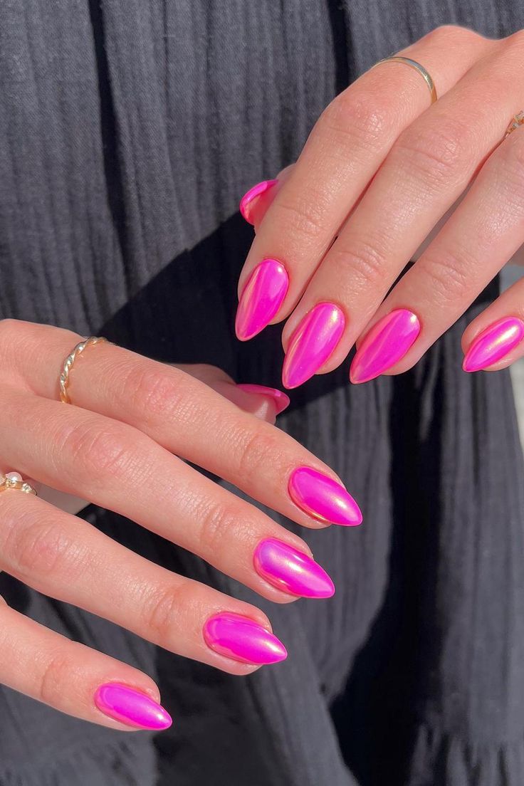 Chic Vibrant Pink Stiletto Nails with Glossy Finish and Gold Accents