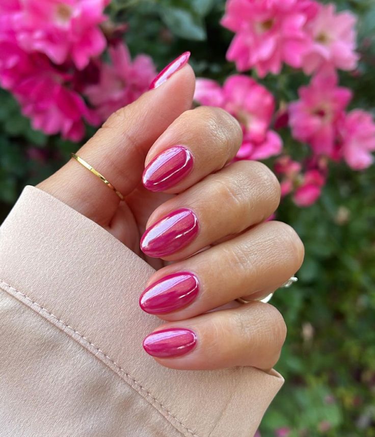 Vibrant Pink Nail Art: Elegant Glossy Finish with Floral Spring Inspiration.