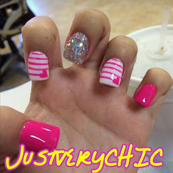 Bold and Playful Vibrant Pink Nail Art with Glittery Accents and Striped Patterns