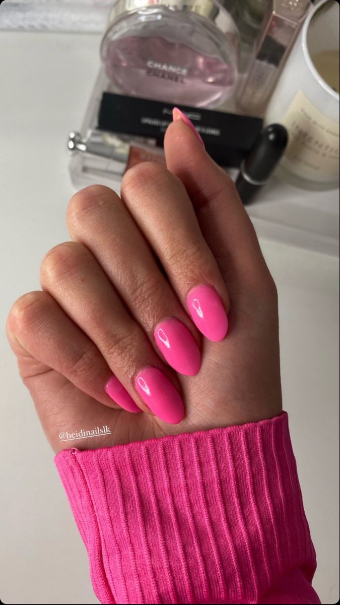 Chic Vibrant Pink Almond-Shaped Nail Design with Glossy Finish for Any Occasion