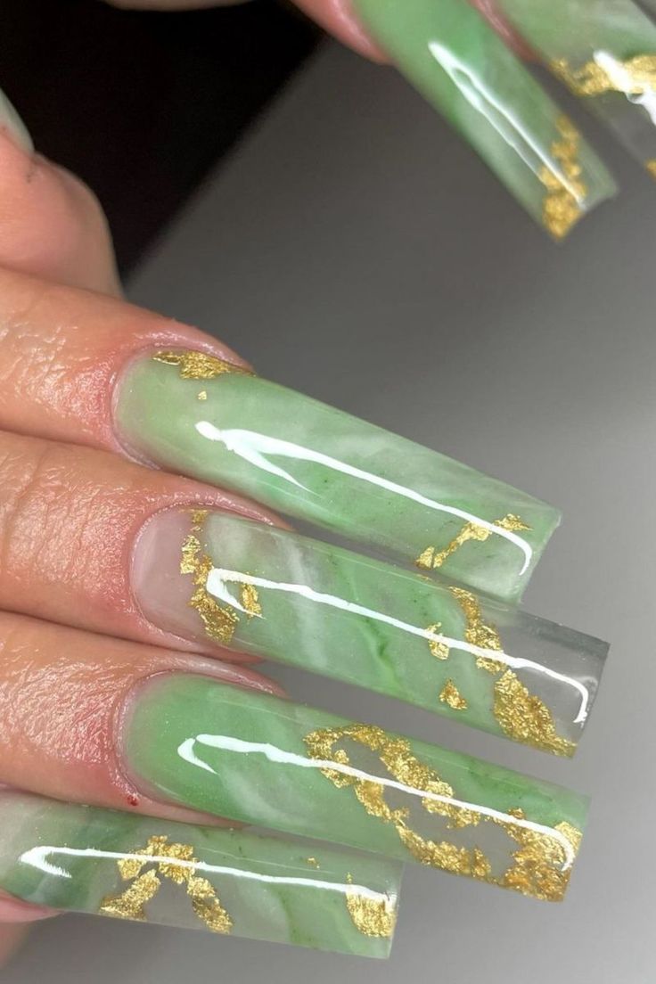 Elegant Marble-Effect Nails with Soft Green Shades and Gold Leaf Accents