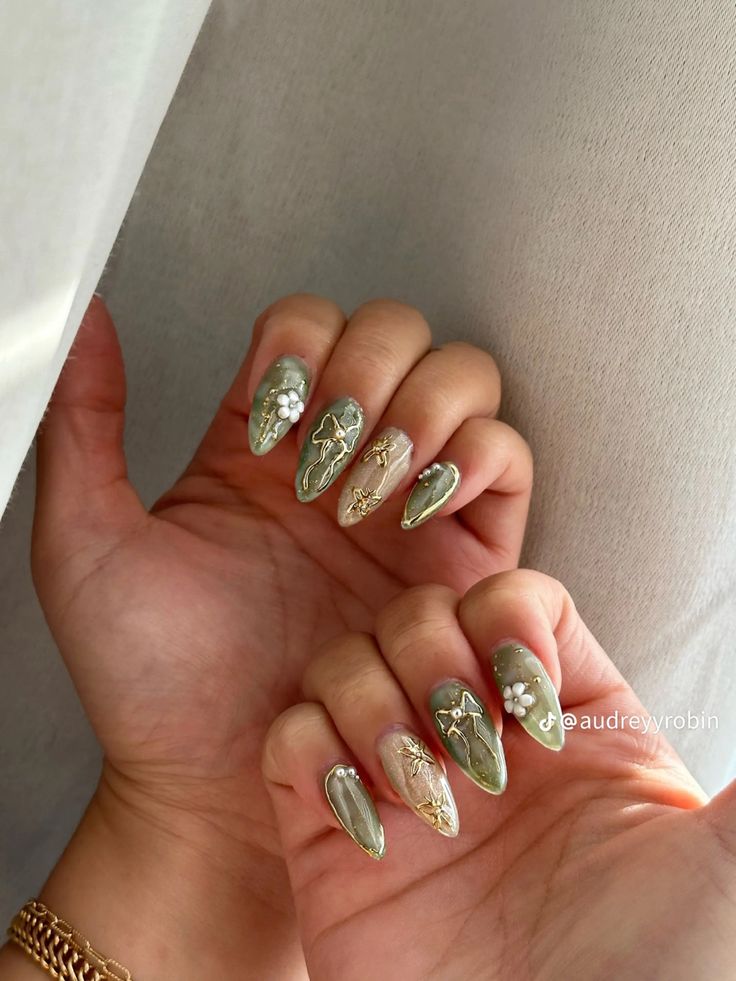 Chic Green Nail Design: Sophisticated Floral and Geometric Elegance with Matte and Glossy Finishes