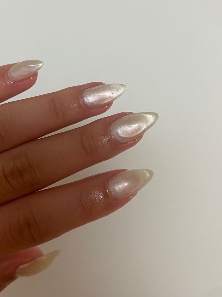 Sophisticated Almond-Shaped Nails with Shimmering Pearl Finish and Glossy Topcoat.