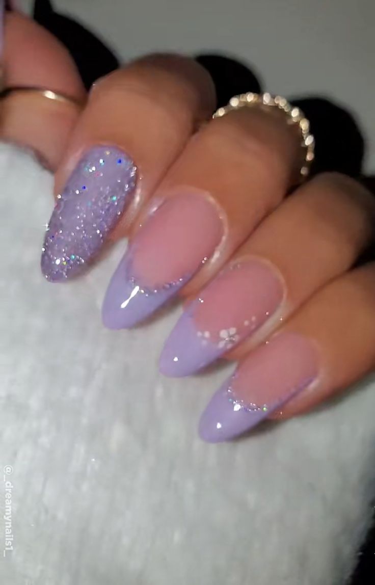 Sophisticated Lavender Nail Design with Glitter and Floral Accents.