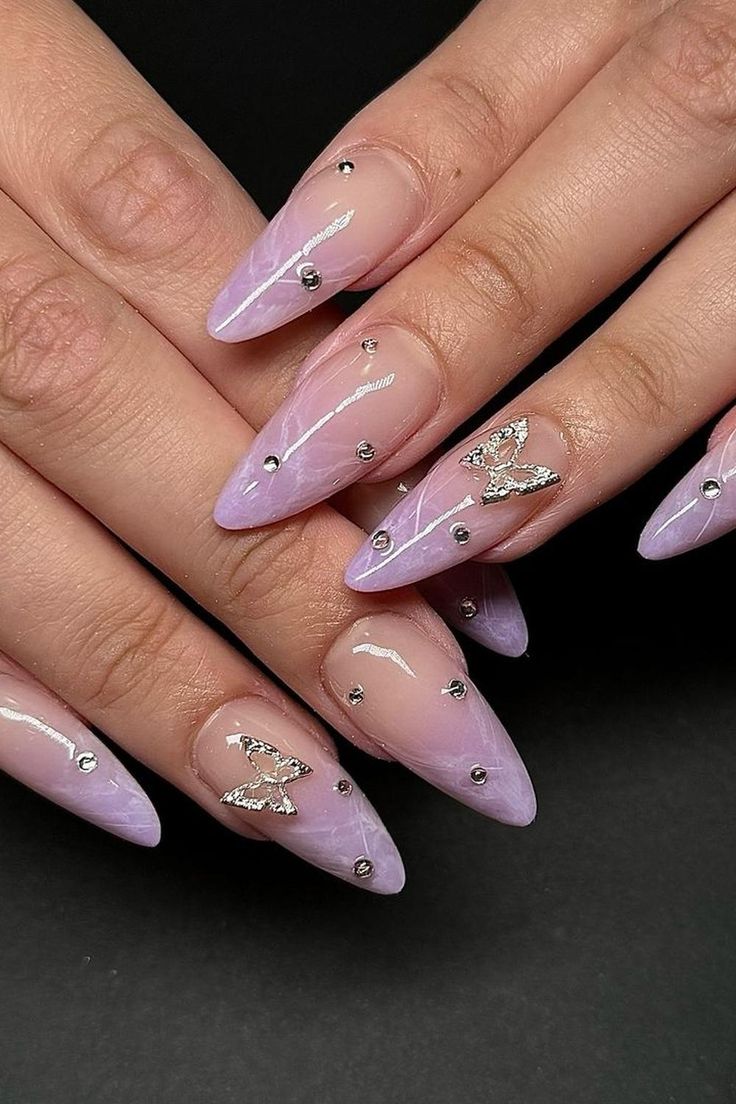 Chic Gradient Lavender Nail Design with Silver Butterfly Accents.