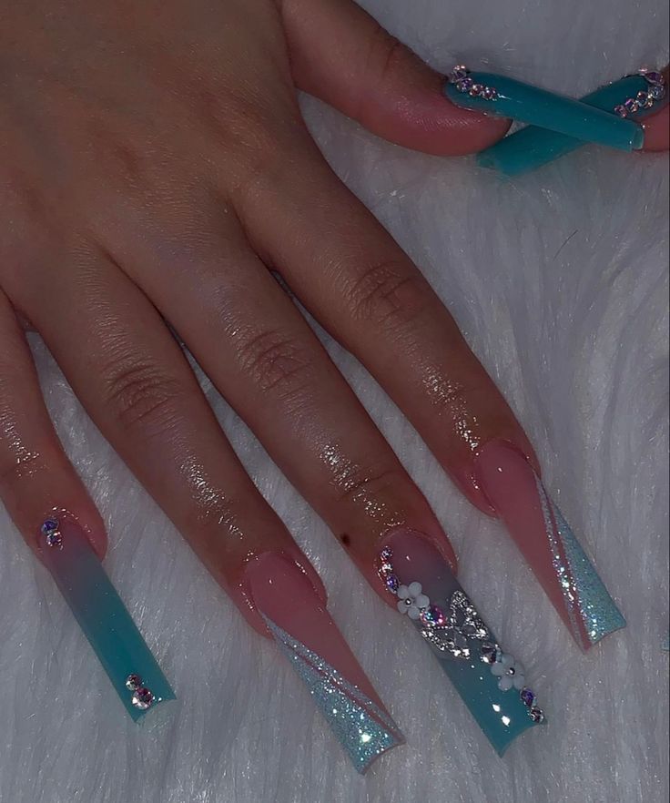 Chic Ombre Nail Design in Pink and Aqua with Glittery Accents.