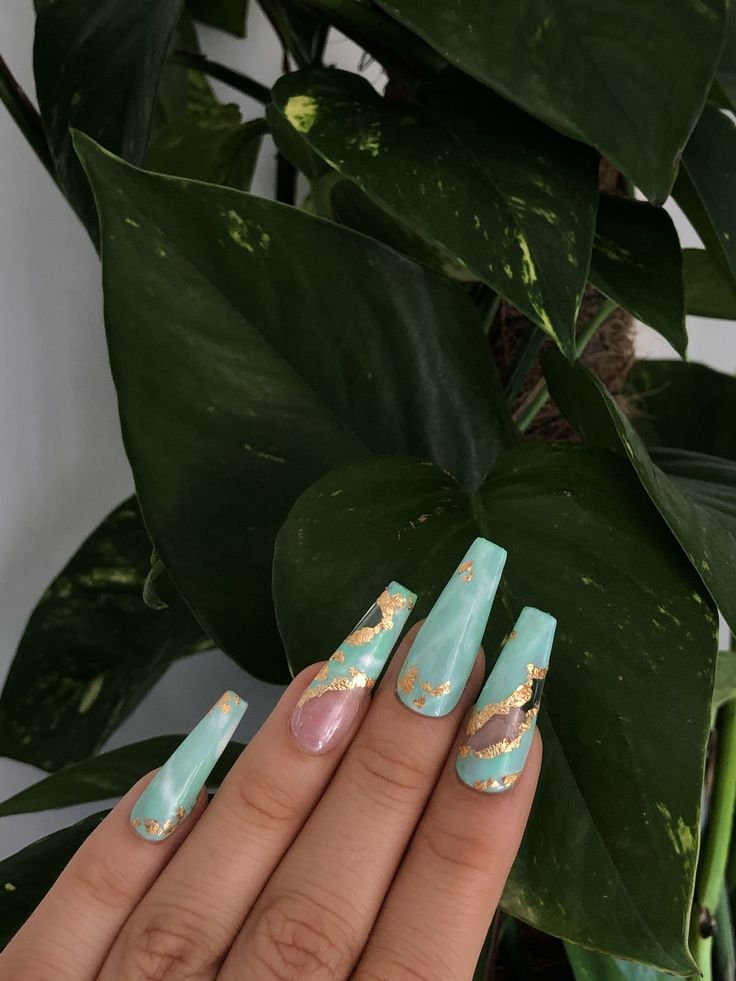 Sophisticated Mint Green Nails with Gold Accents and Playful Pink Contrast.