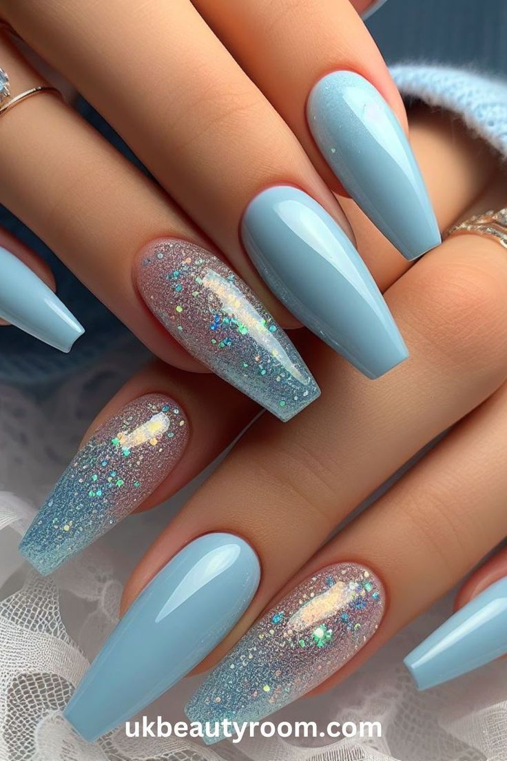 Chic Elegant Blue Nail Design with Glittery Accents for Spring/Summer.