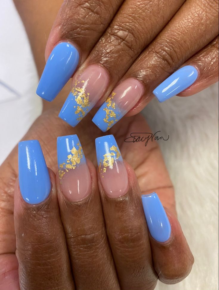 Elegant Sky-Blue Nail Design with Glamorous Gold Accents and Modern Nude Sections