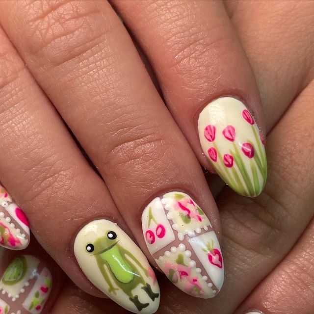 Charming Whimsical Nail Art: Playful Frog, Floral Patterns, and Vibrant Pink Accents.