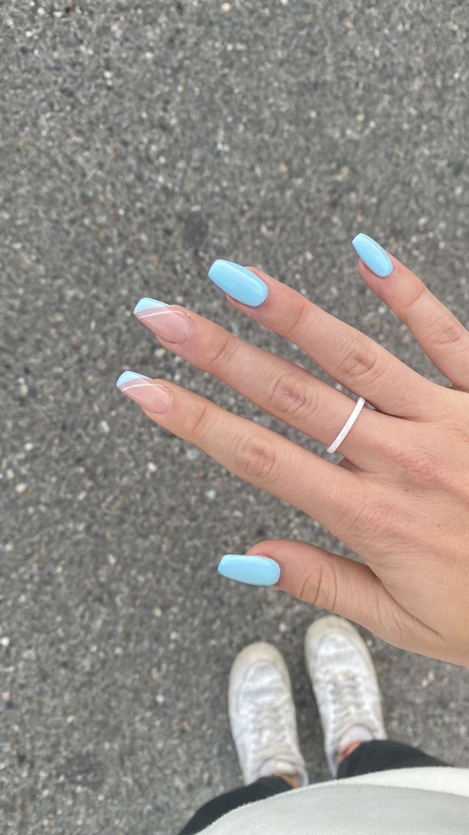 Elegant Pastel Blue Nail Design with Glossy Finish and Subtle Ombre Accent.