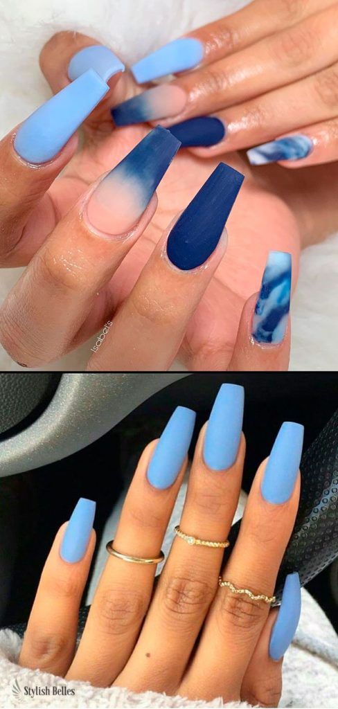 Elegant Ombre Blue Nail Design with Marbled Accents and Textured Finishes.