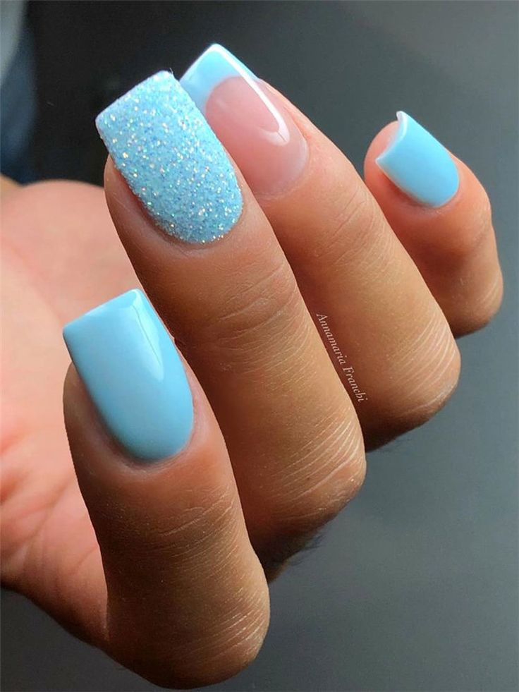 Chic Blue Nail Design with Textured Finishes for a Stylish Summer Look.