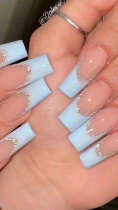 Elegant Light Blue and Nude Modern French Tip Nail Design with Sparkling Accents.